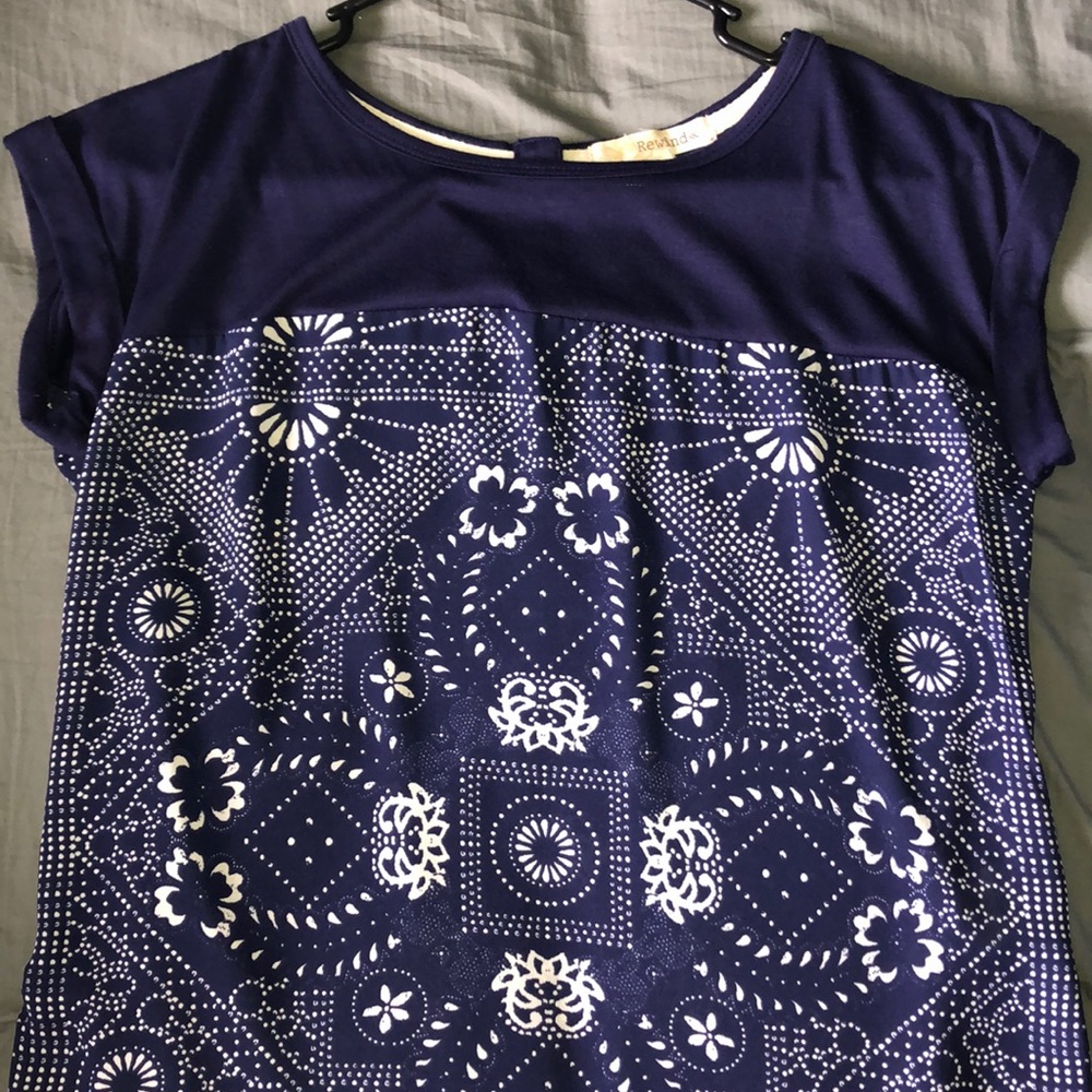 Navy blue top with white design